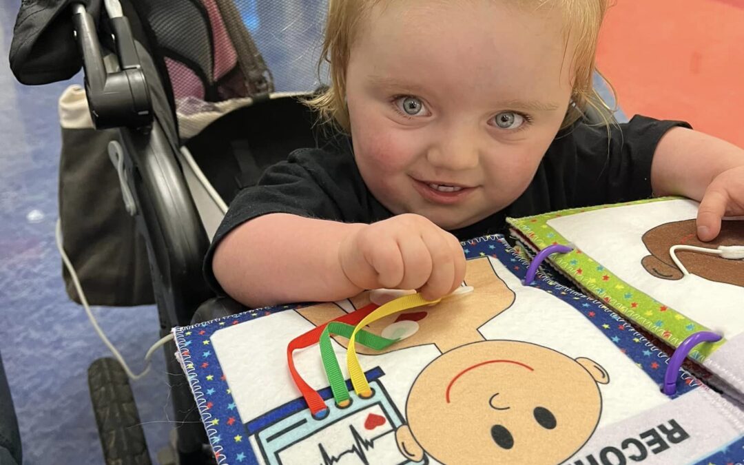 Zoey enjoying her LovefromLevi hospital book before surgery